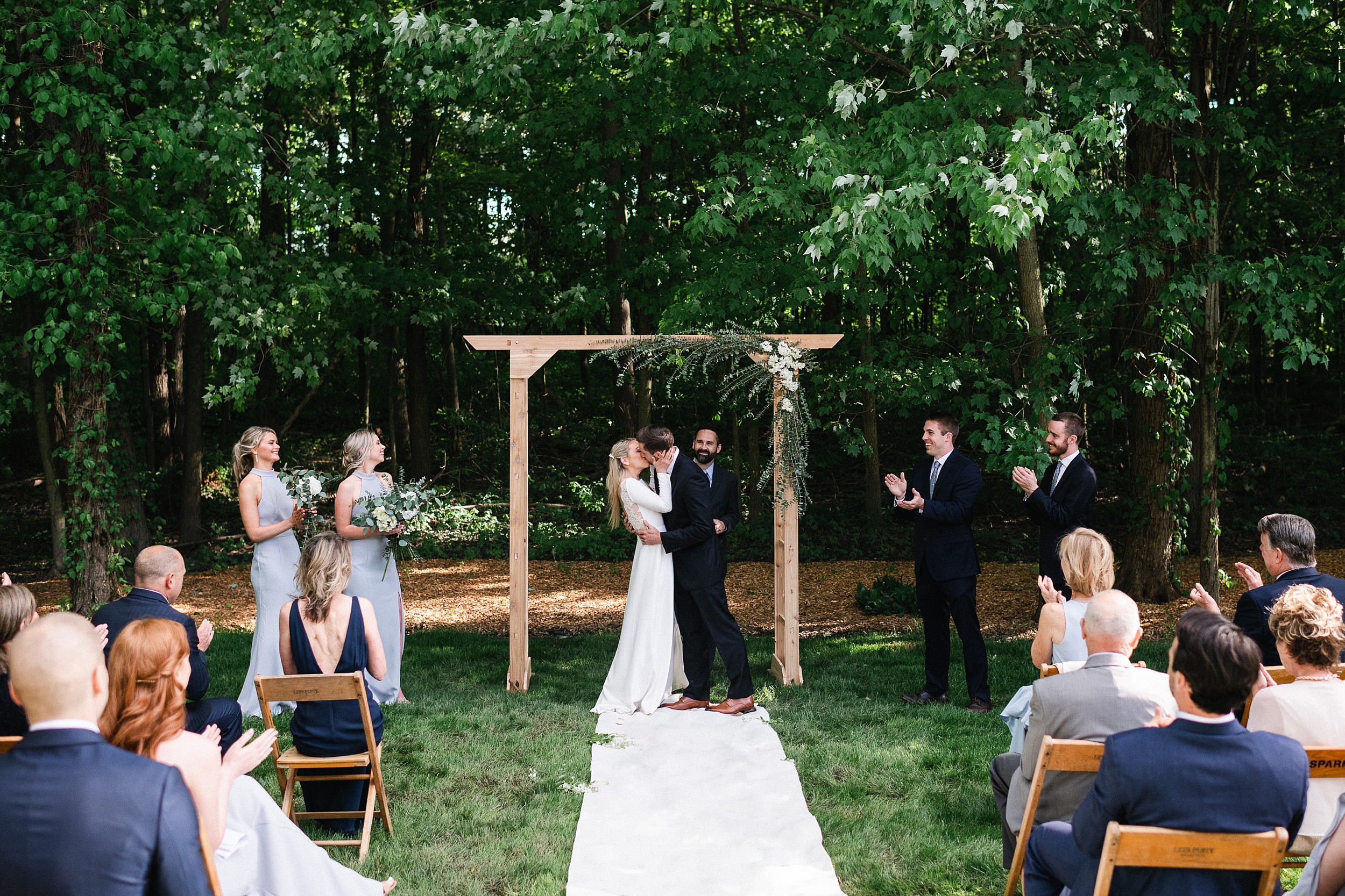 couple kissing in backyard wedding ohio