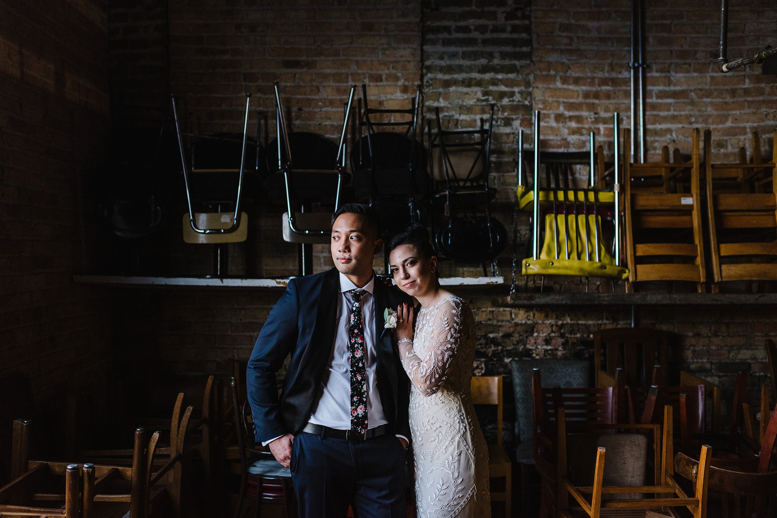 portrait in front of schoolhouse chairs