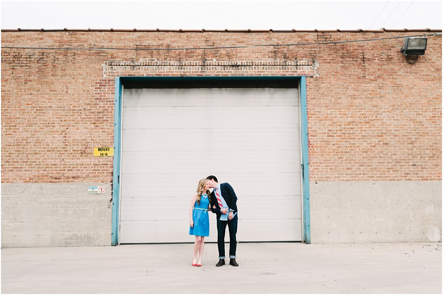 Brick and garage backdrop for engagement photography.