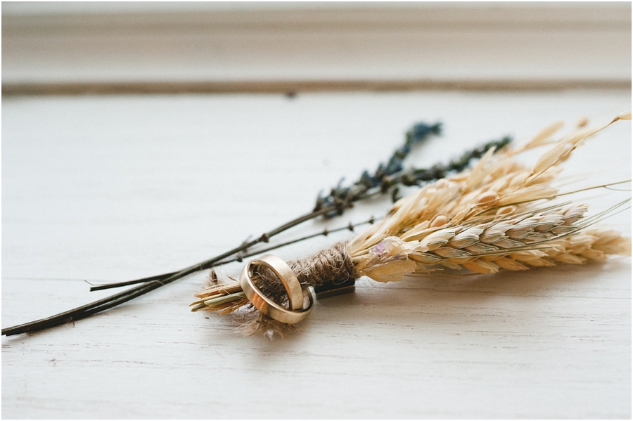 wheat boutonniere with gold rings